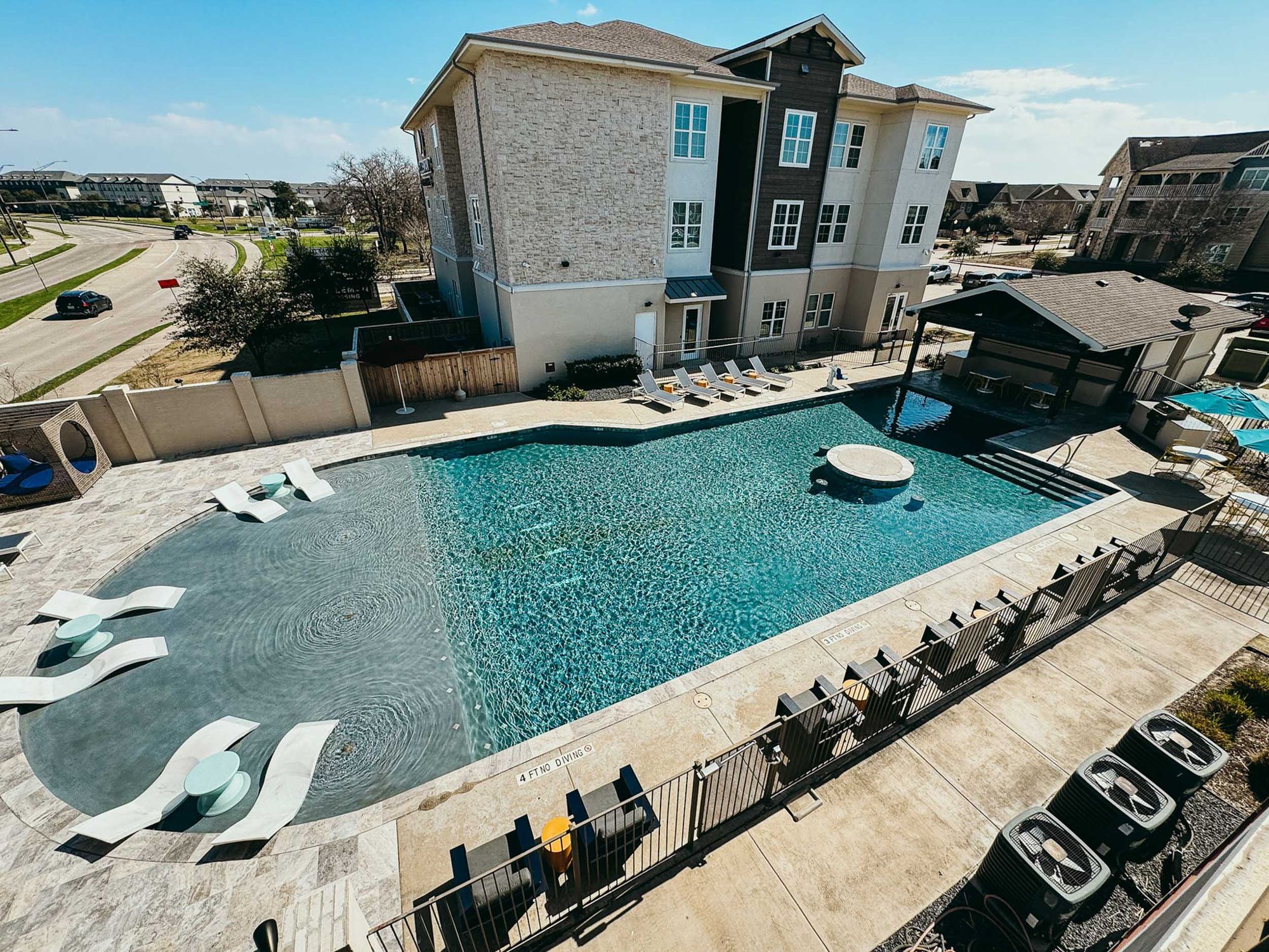 holleman crossing apartments near texas am university resort style pool aerial view